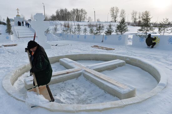 Preparation of ice holes for Epiphany bathing in Russia