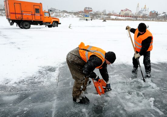 Preparation of ice holes for Epiphany bathing in Russia