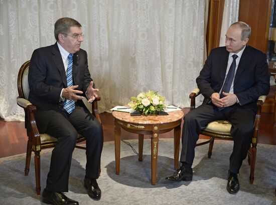 Vladimir Putin meets with IOC President Thomas Bach
