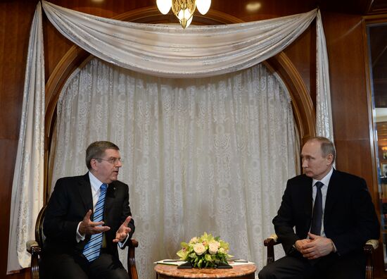 Vladimir Putin meets with IOC President Thomas Bach