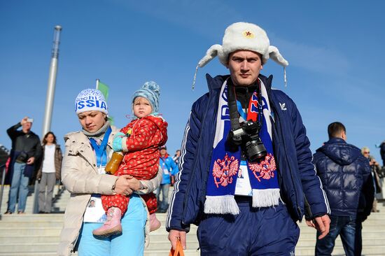 Spectators arrive for the XXII Olympic Winter Games opening