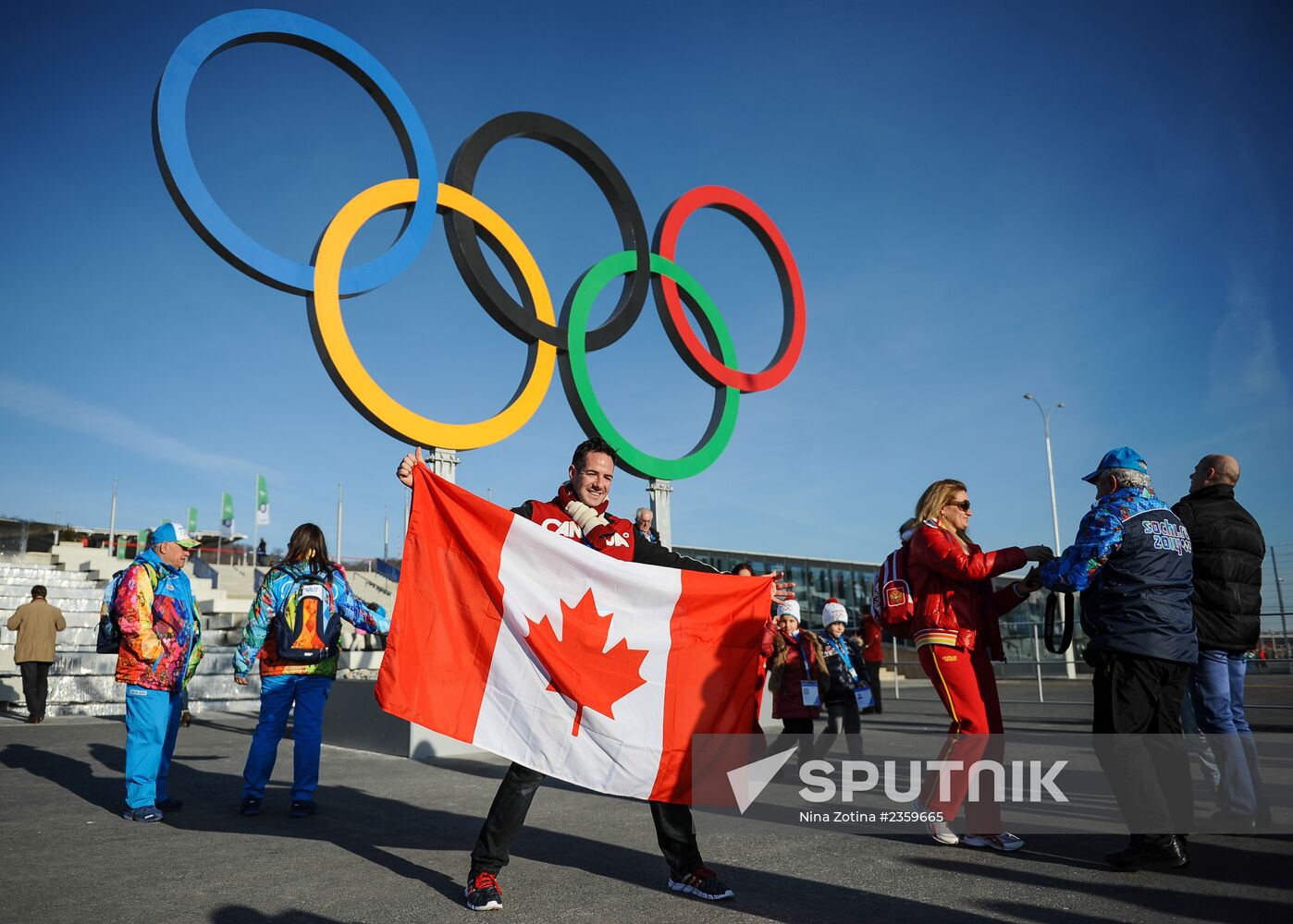 Spectators arrive for the XXII Olympic Winter Games opening