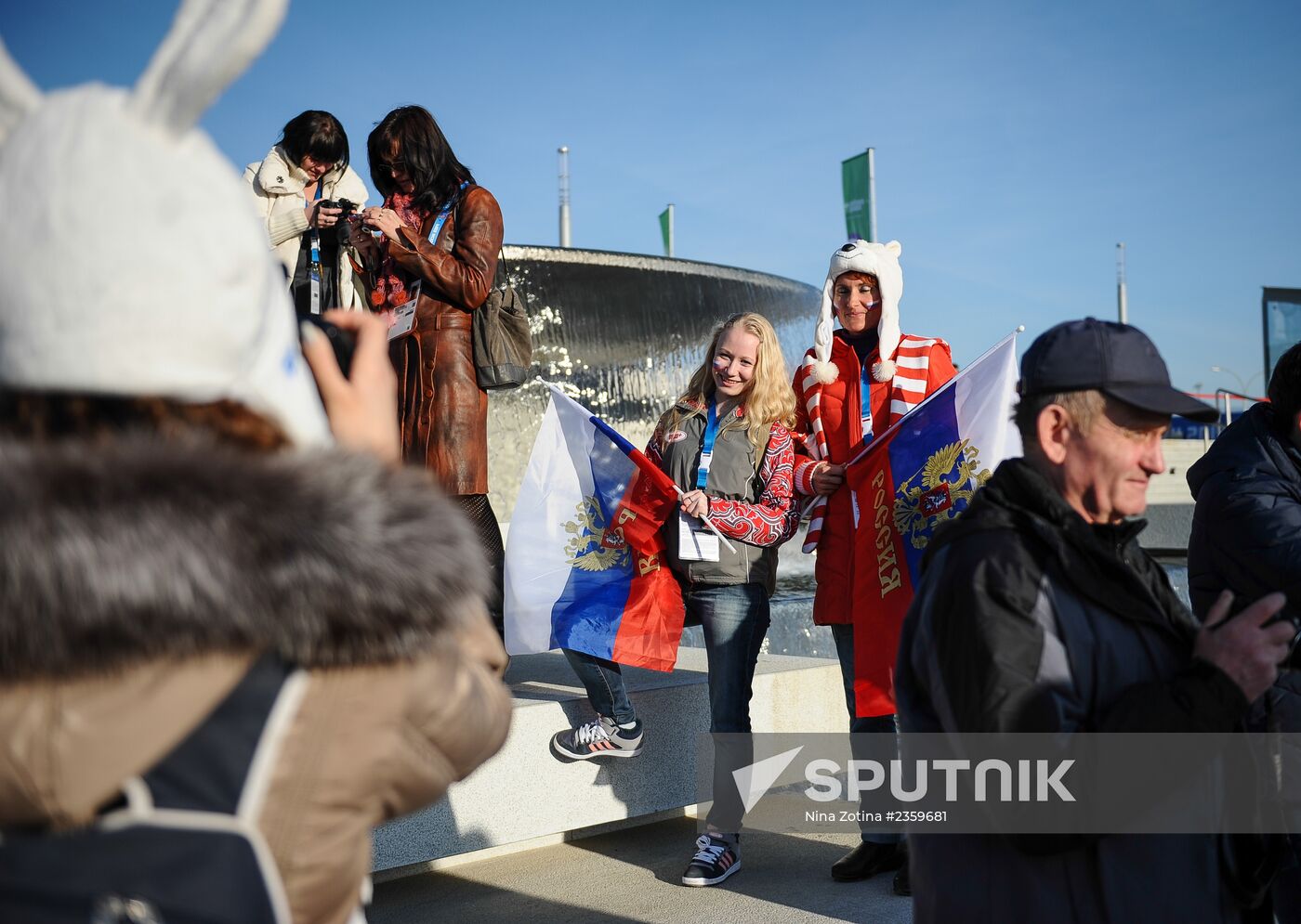 Spectators arrive for the XXII Olympic Winter Games opening