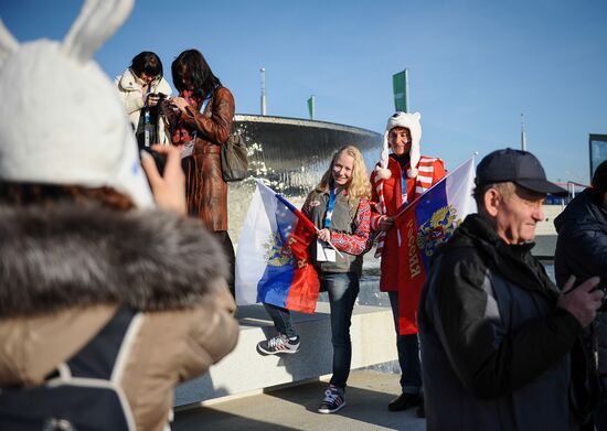 Spectators arrive for the XXII Olympic Winter Games opening