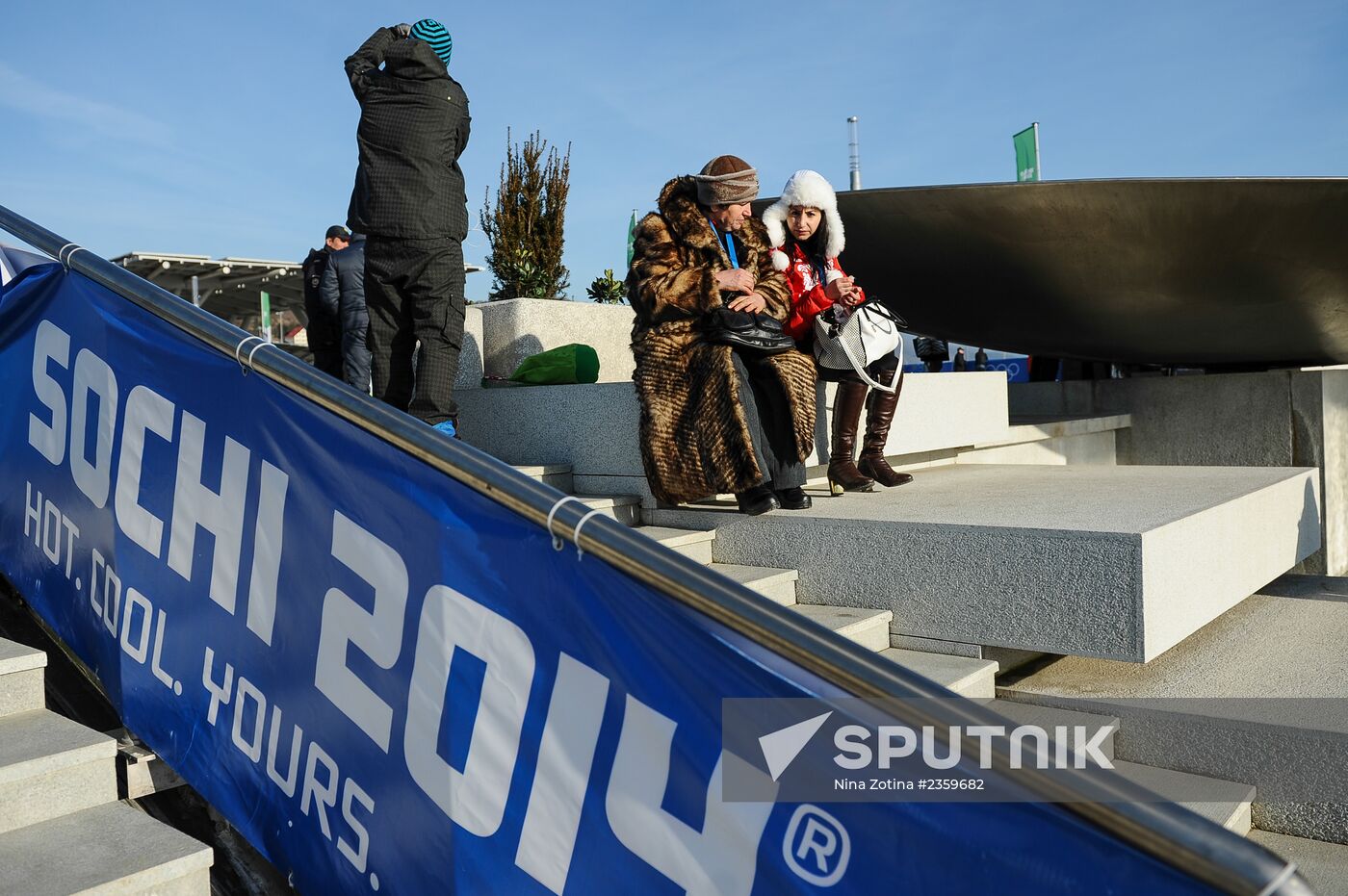 Spectators arrive for the XXII Olympic Winter Games opening