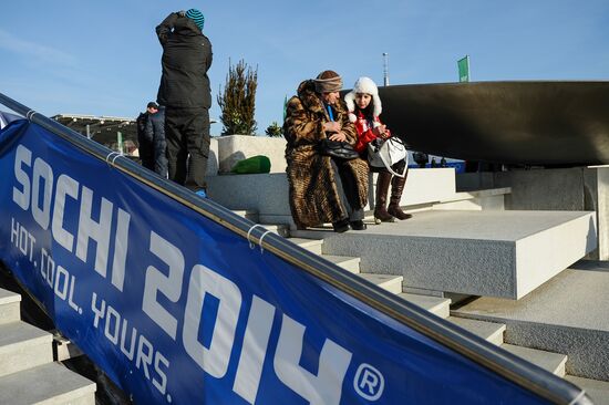 Spectators arrive for the XXII Olympic Winter Games opening