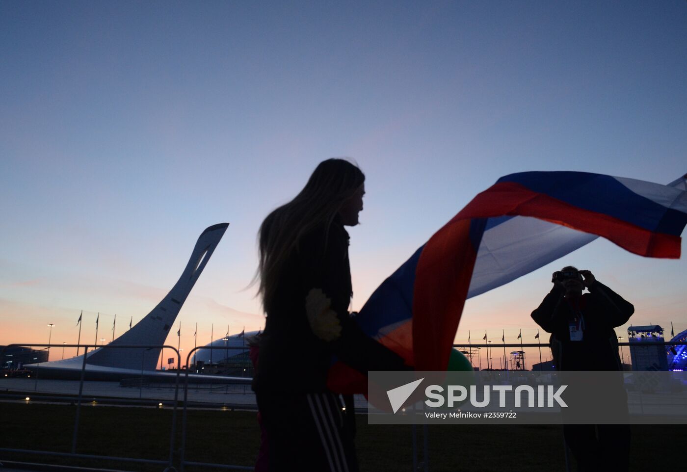 Spectators arrive at the open ceremony of the 2014 Winter Olympics