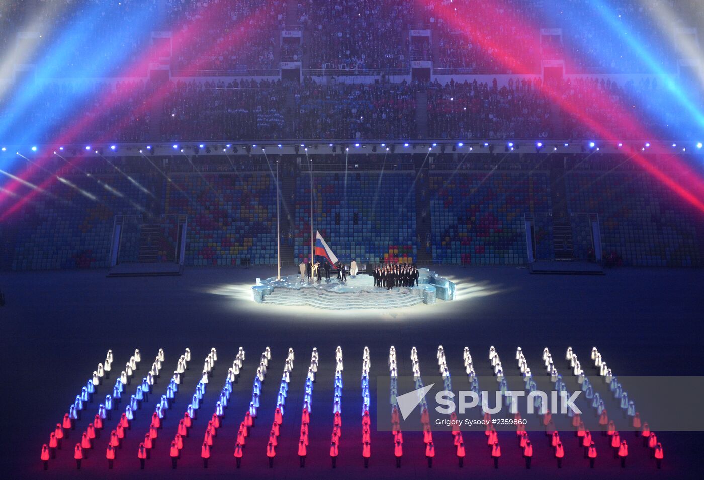 Spectators arrive at the opening ceremony of the XXI Olympic Winter Games