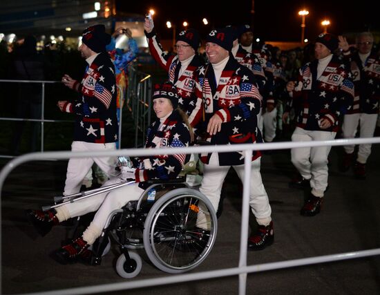 Spectators arrive at the opening ceremony of the XXI Olympic Winter Games