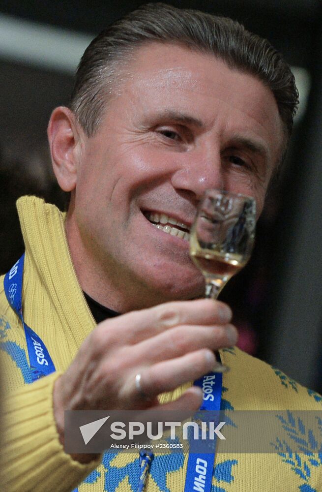 Spectators arrive for the XXII Olympic Winter Games opening