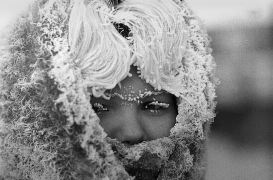 A young woman in severe cold