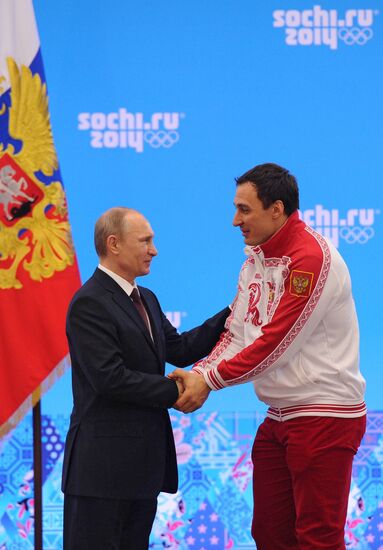 Vladimir Putin during award ceremony for Russian Olympic medalists in Sochi