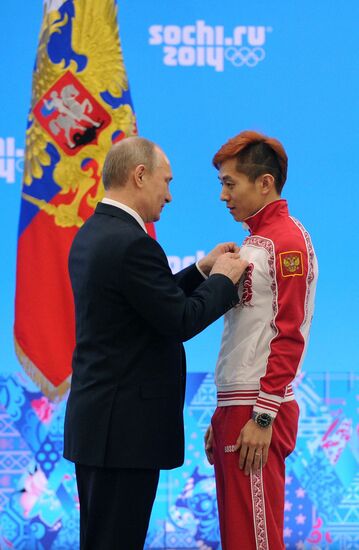 Vladimir Putin during award ceremony for Russian Olympic medalists in Sochi