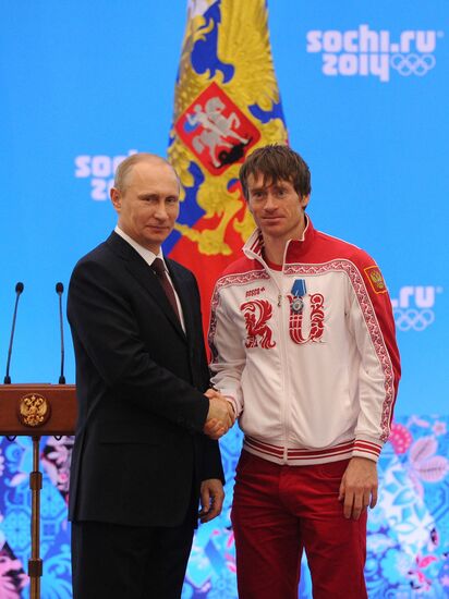 Vladimir Putin during award ceremony for Russian Olympic medalists in Sochi