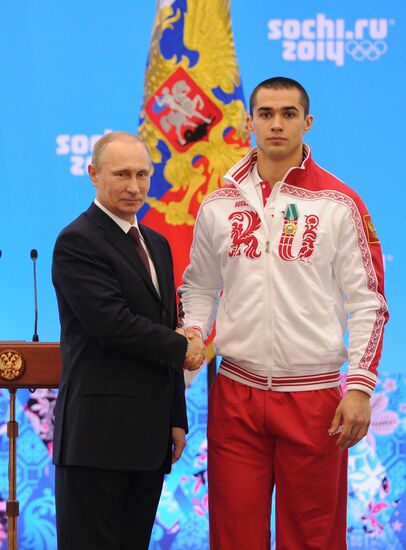 Vladimir Putin during award ceremony for Russian Olympic medalists in Sochi