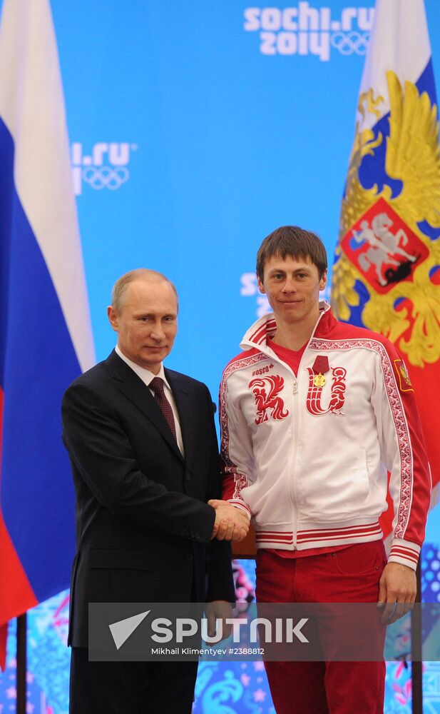 Vladimir Putin during award ceremony for Russian Olympic medalists in Sochi