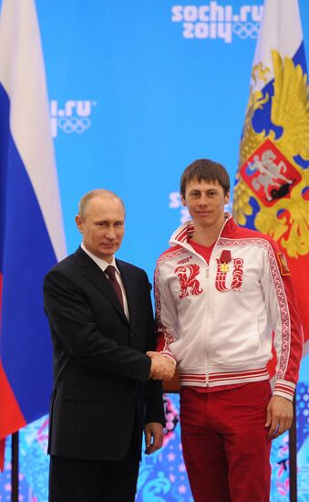 Vladimir Putin during award ceremony for Russian Olympic medalists in Sochi