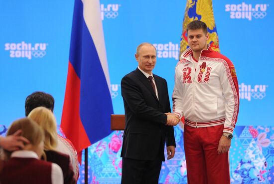 Vladimir Putin during award ceremony for Russian Olympic medalists in Sochi