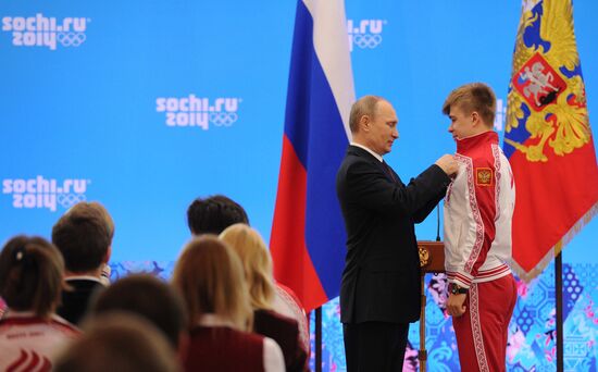 Vladimir Putin during award ceremony for Russian Olympic medalists in Sochi