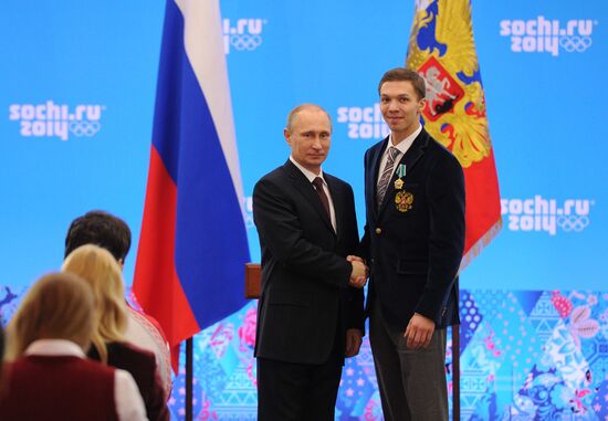 Vladimir Putin during award ceremony for Russian Olympic medalists in Sochi