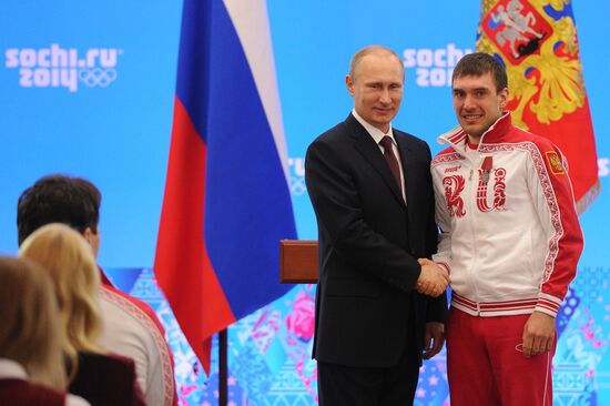 Vladimir Putin during award ceremony for Russian Olympic medalists in Sochi