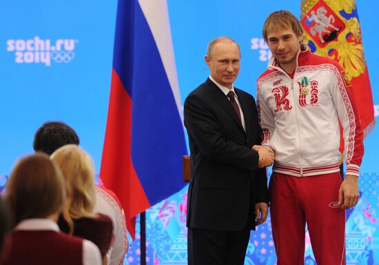 Vladimir Putin during award ceremony for Russian Olympic medalists in Sochi