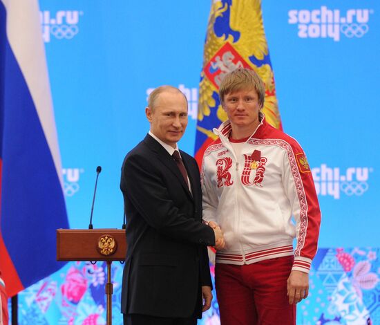 Vladimir Putin during award ceremony for Russian Olympic medalists in Sochi