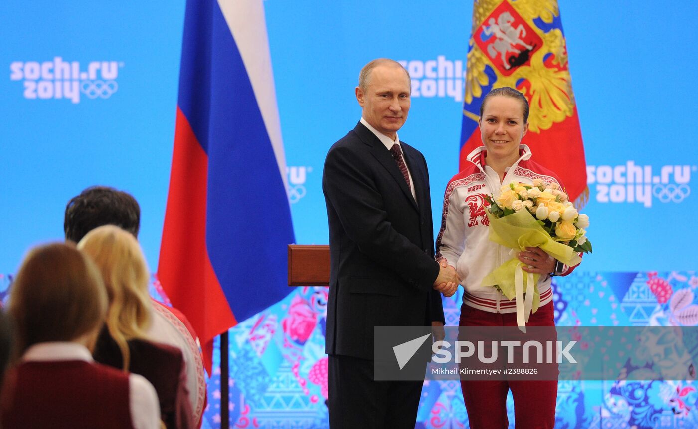 Vladimir Putin during award ceremony for Russian Olympic medalists in Sochi
