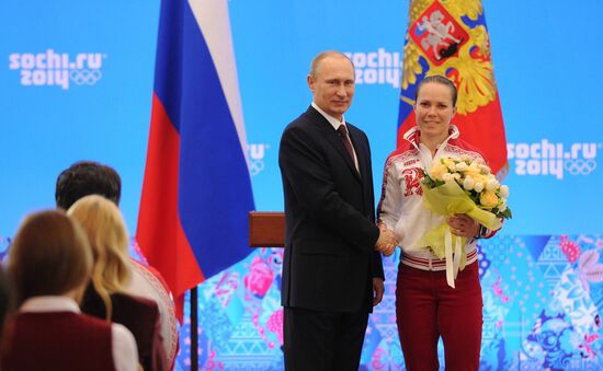Vladimir Putin during award ceremony for Russian Olympic medalists in Sochi