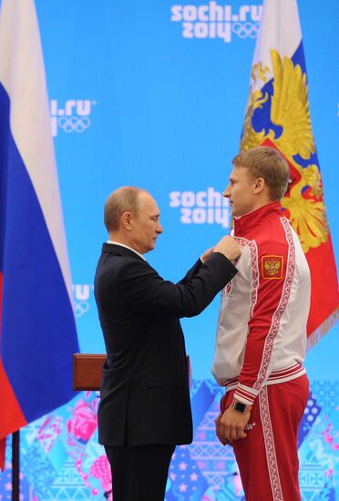 Vladimir Putin during award ceremony for Russian Olympic medalists in Sochi
