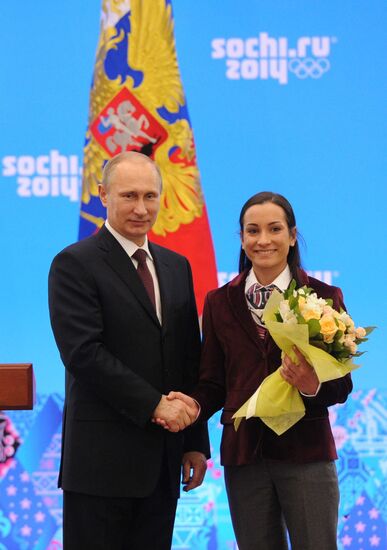 Vladimir Putin during award ceremony for Russian Olympic medalists in Sochi