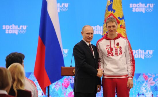Vladimir Putin during award ceremony for Russian Olympic medalists in Sochi