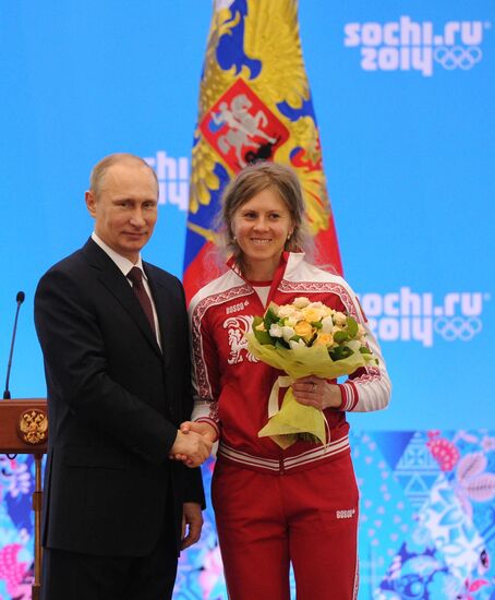 Vladimir Putin during award ceremony for Russian Olympic medalists in Sochi