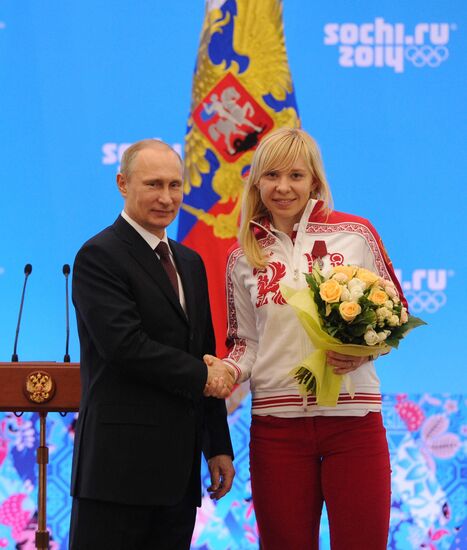 Vladimir Putin during award ceremony for Russian Olympic medalists in Sochi