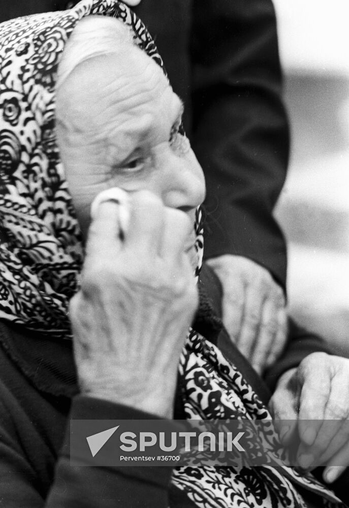 ELDERLY WOMAN WEEPING WWII REMINISCENCES