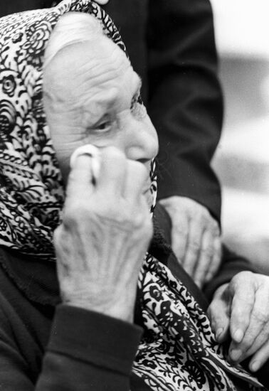ELDERLY WOMAN WEEPING WWII REMINISCENCES
