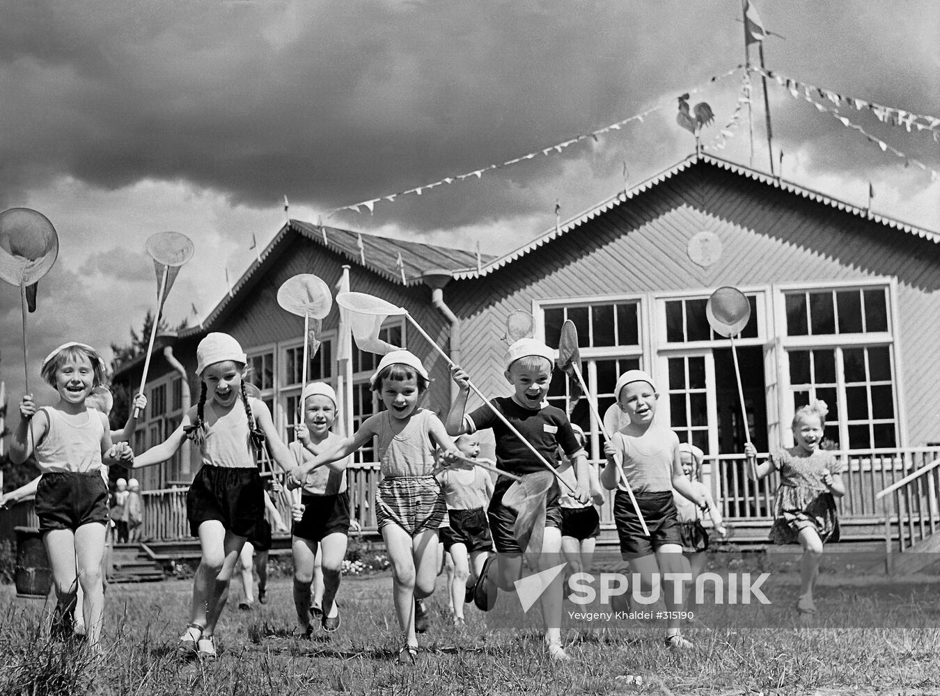 Children from a daycare center near their dacha in summer
