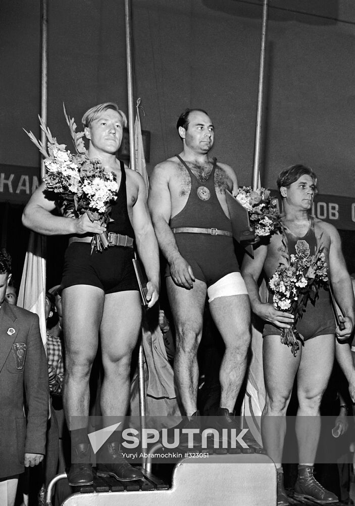 Weightlifters Vitaly Dvigun, Arkady Vorobyov and Vasily Stepanov