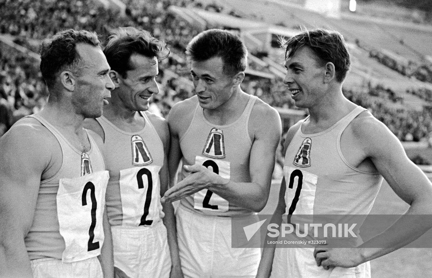 Soviet track and field athletes (left to right) Konstantin Grachev, Vladimir Yefishin, Valery Bulyshev and Ardalion Ignatyev after the relay race