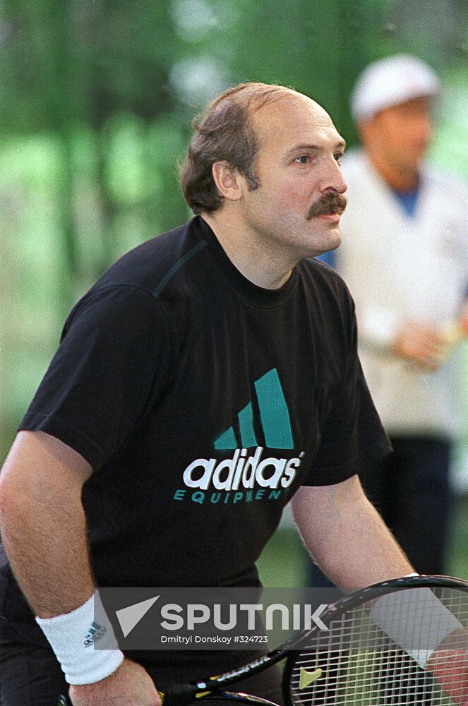 Belarusian President Alexander Lukashenko playing tennis