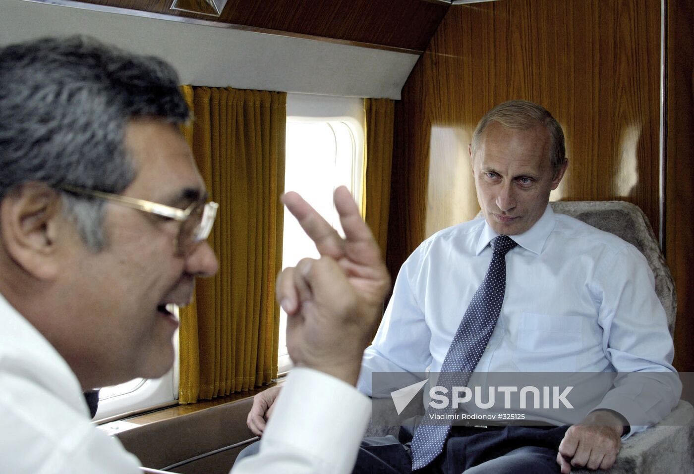 Vladimir Putin and Aman Tuleyev in helicopter cabin