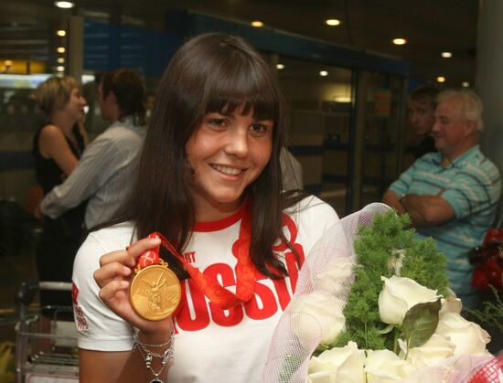 Russian sportsmen arriving back in Moscow