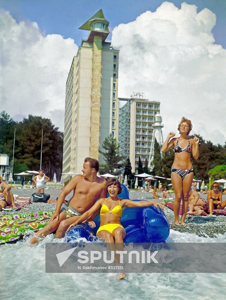 Vacationers on the beach of Pitsunda vacation hotel