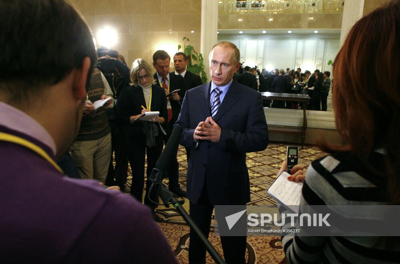 Prime Minister Vladimir Putin faces reporters