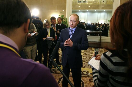 Prime Minister Vladimir Putin faces reporters