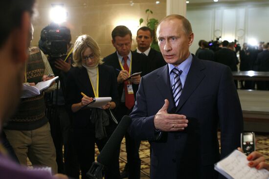 Prime Minister Vladimir Putin faces reporters