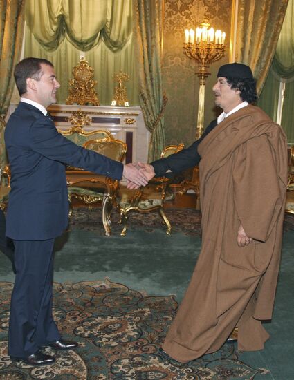 Dmitry Medvedev and Muammar Qaddafi