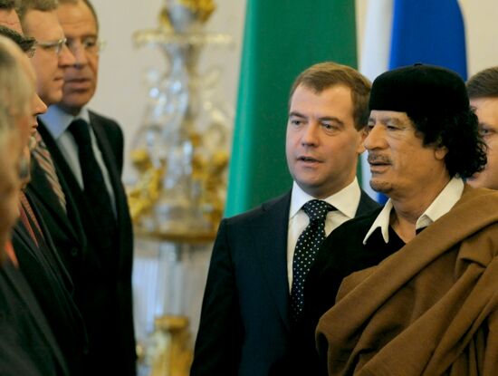 Dmitry Medvedev and Muammar Qaddafi