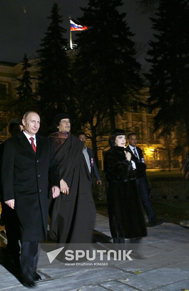 Vladimir Putin and Muammar Qaddafi