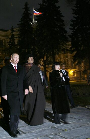 Vladimir Putin and Muammar Qaddafi